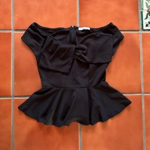 Black top. Nice fit to show waist.